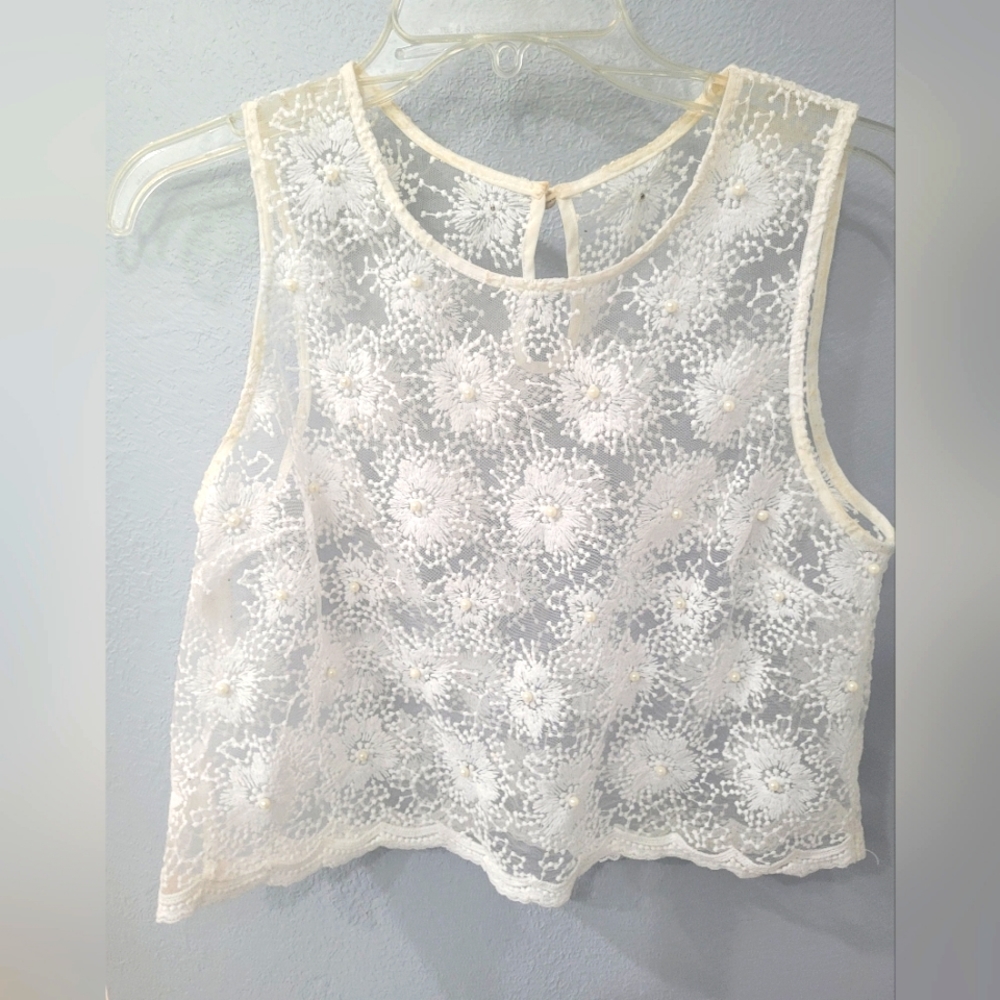 Lace vest with pearl embellishments